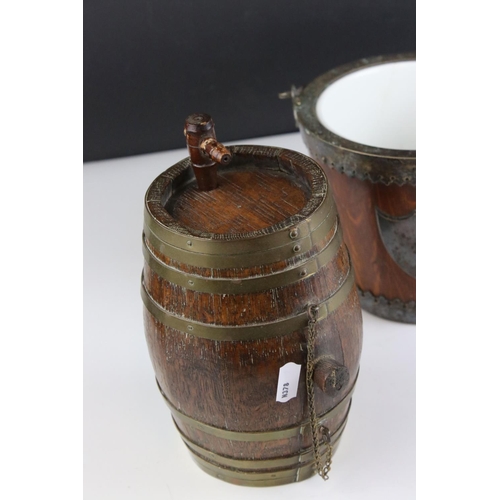 429 - A group of three wooden collectables to include a biscuit barrel, a tea caddy and a brass bound keg.