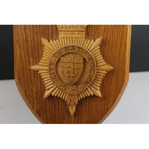 441 - A City of Bath Police oak shield together with a framed 150 years of policing in Bath picture.