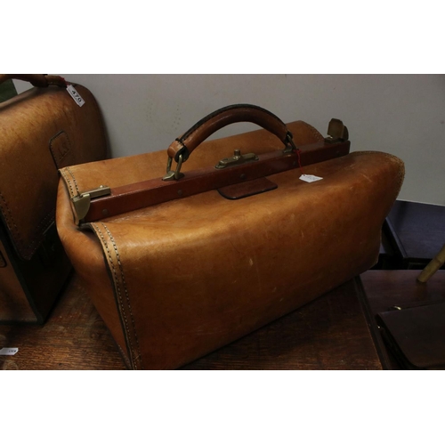 470 - A group of three leather bags to include a Gladstone bag by Atelier Pedro.