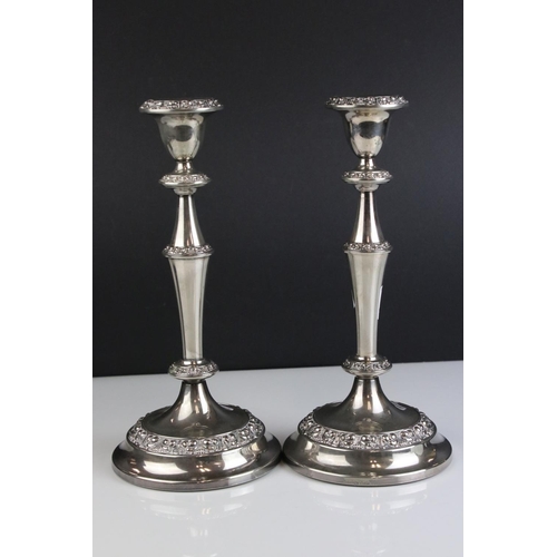 475 - A pair of silver plated antique style candlesticks .