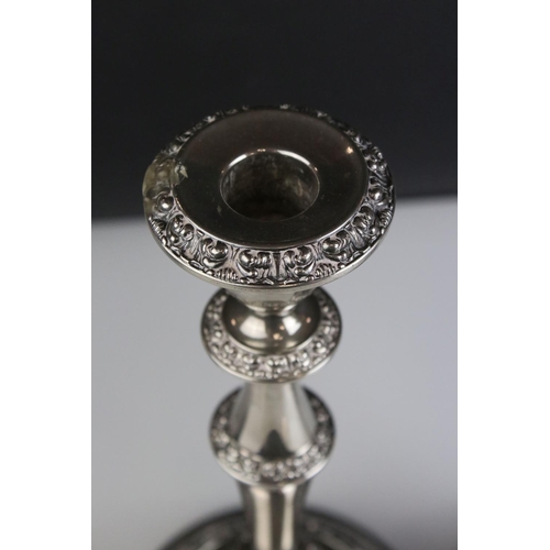 475 - A pair of silver plated antique style candlesticks .