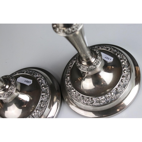 475 - A pair of silver plated antique style candlesticks .