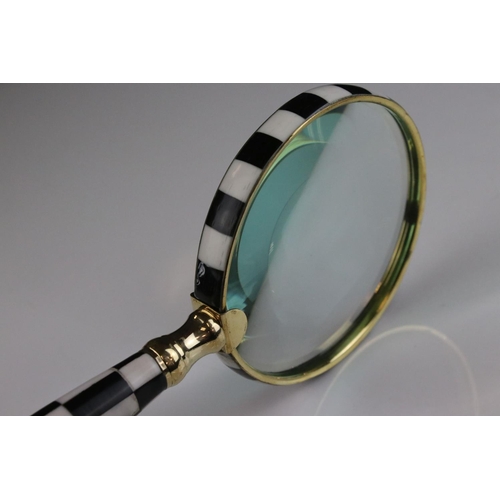 476 - Large hand held magnifying glass set with checkerboard handle