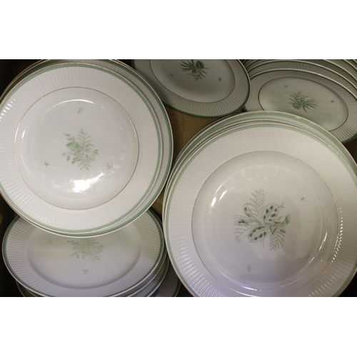 488 - A Royal Copenhagen Gron Melodi set of plates of various sizes together with bowls.