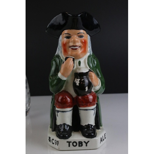 512 - A vintage advertising Toby jug together with a cut glass vase.