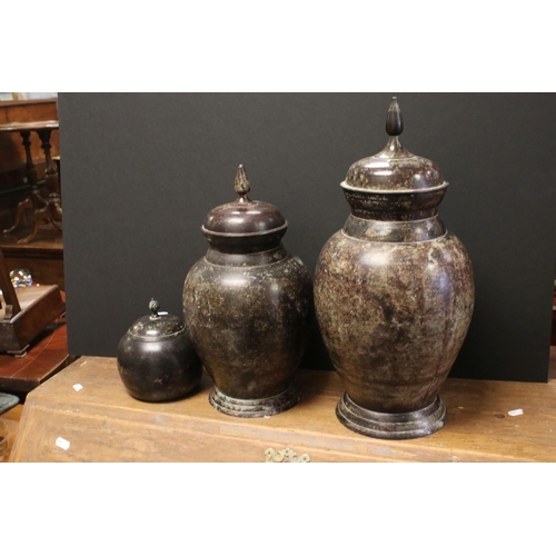 519 - Three modern decorative vases and covers, with verdigris effect surface, tallest approx 45cm high