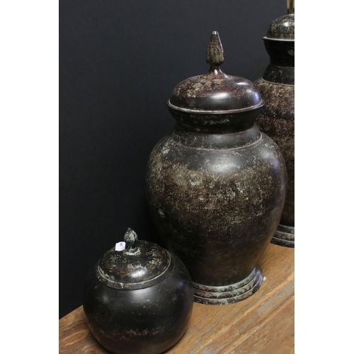 519 - Three modern decorative vases and covers, with verdigris effect surface, tallest approx 45cm high