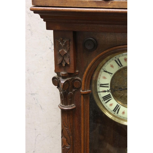 521 - A antique Vienna style drop dial twin train movement wall clock with brass weights.