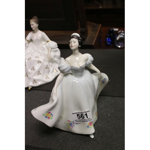 561 - A collection of mixed ceramics to include three Royal Doulton figurines, two Beswick ornaments and a... 