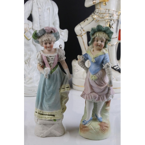 567 - A group of mixed ceramic figures to include two Staffordshire figures, together with two novelty tea... 