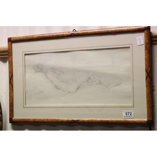 572 - A framed and glazed pencil drawing sketch of a recumbent nude women unsigned 20 x 43 cm.