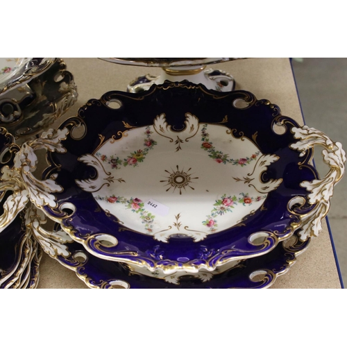 595 - A late 19th century blue and white ground part dinner service with floral swag decoration. Part of a... 