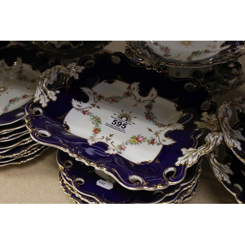 595 - A late 19th century blue and white ground part dinner service with floral swag decoration. Part of a... 