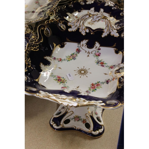 595 - A late 19th century blue and white ground part dinner service with floral swag decoration. Part of a... 