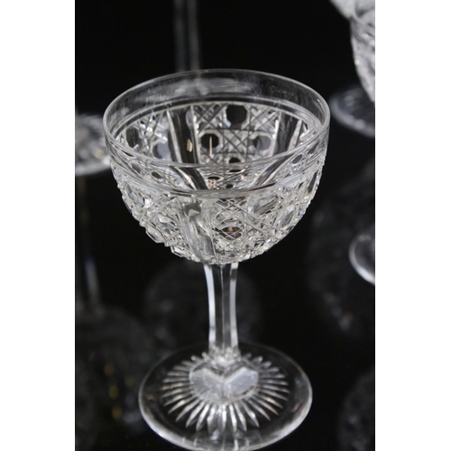 597 - A large quantity of good quality cut glass wine glasses,rummers jug etc.