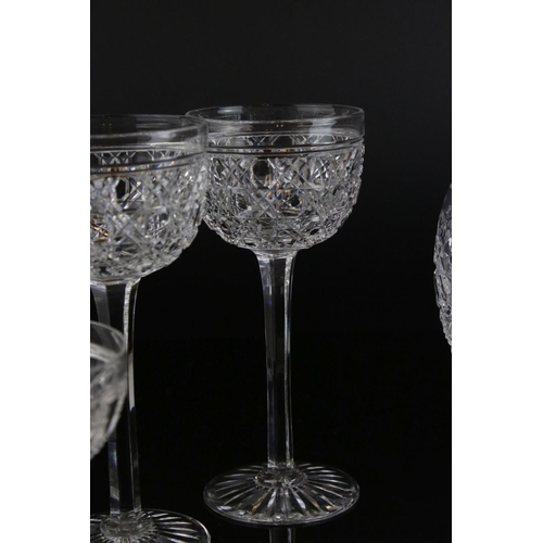 597 - A large quantity of good quality cut glass wine glasses,rummers jug etc.