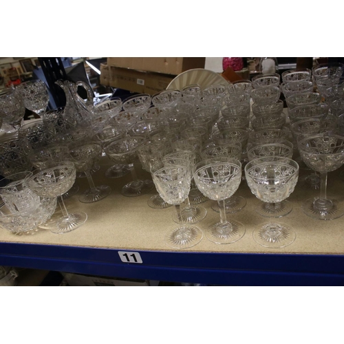 597 - A large quantity of good quality cut glass wine glasses,rummers jug etc.