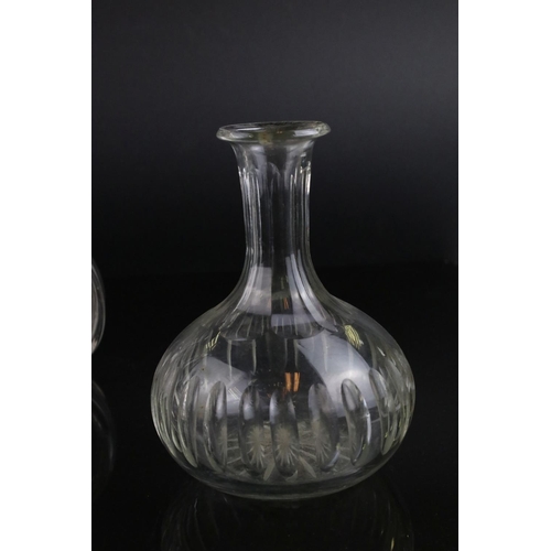 598 - A pair of antique baluster shaped glass decanters and three others without stoppers.