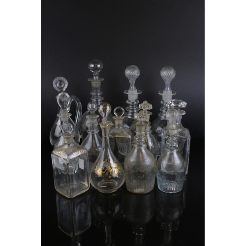 607 - A quantity of 19th century glass decanters some with etched and gilt decoration and a similar claret... 