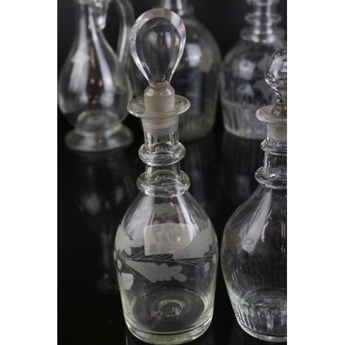 607 - A quantity of 19th century glass decanters some with etched and gilt decoration and a similar claret... 