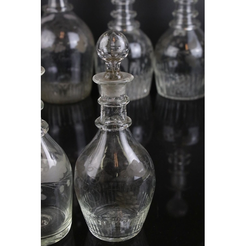 607 - A quantity of 19th century glass decanters some with etched and gilt decoration and a similar claret... 