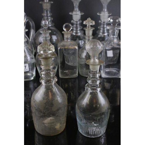 607 - A quantity of 19th century glass decanters some with etched and gilt decoration and a similar claret... 