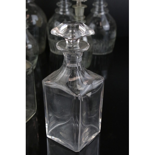 607 - A quantity of 19th century glass decanters some with etched and gilt decoration and a similar claret... 