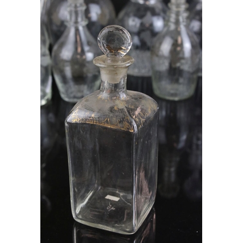 607 - A quantity of 19th century glass decanters some with etched and gilt decoration and a similar claret... 