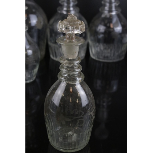 607 - A quantity of 19th century glass decanters some with etched and gilt decoration and a similar claret... 