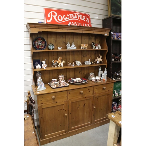 641 - Pine Dresser with three drawers over three cupboard doors, 151cms long x 192cms high