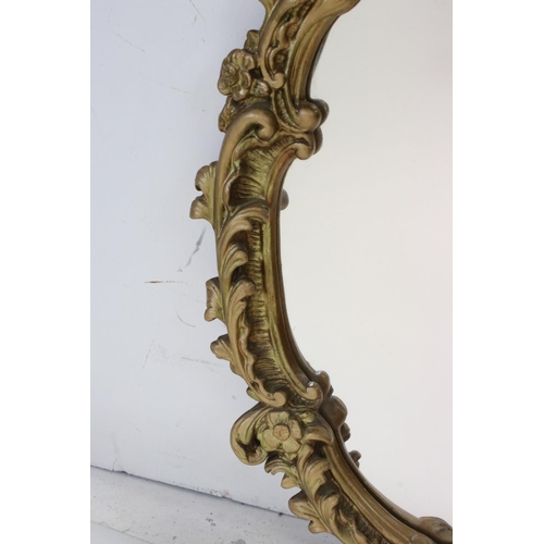 655 - 20th century Rococo style Gilt Oval Mirror, 67cms high