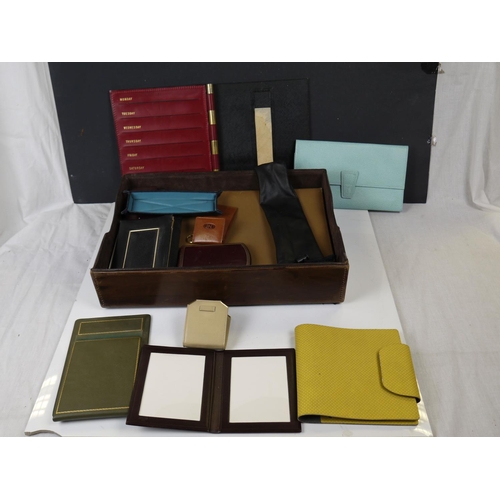 543 - A selection of notebooks, folios and purses together with a Seiko travel clock.