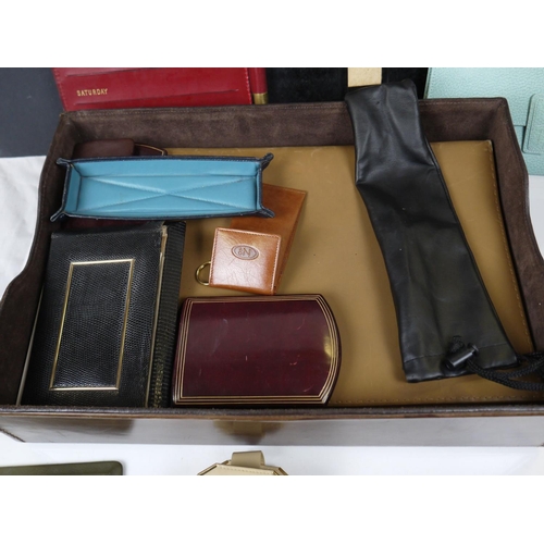 543 - A selection of notebooks, folios and purses together with a Seiko travel clock.