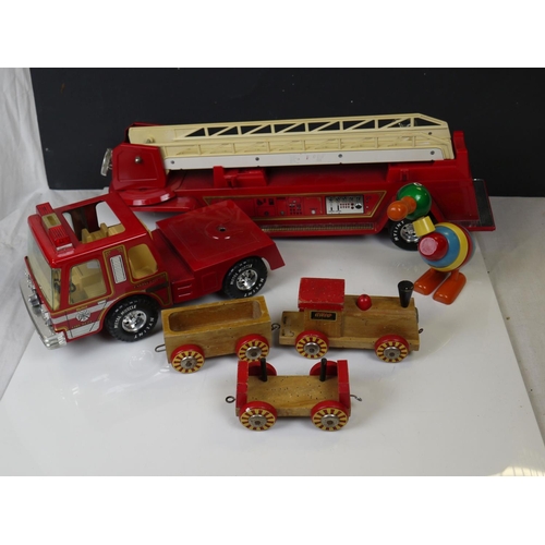 550 - A vintage wooden Brio toy train together with a large metal Nylint toy fire engine.