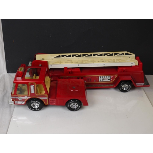 550 - A vintage wooden Brio toy train together with a large metal Nylint toy fire engine.