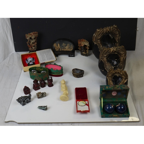 552 - A group of Chinese collectables to include soapstone carvings, Boading balls and Buddha ornaments.