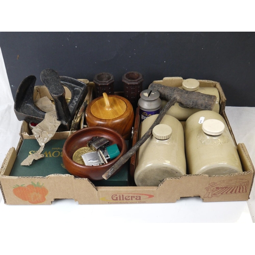 554 - A box of mixed collectables to include ceramic hot water bottles, lighters, carpet bowls and a shoe ... 