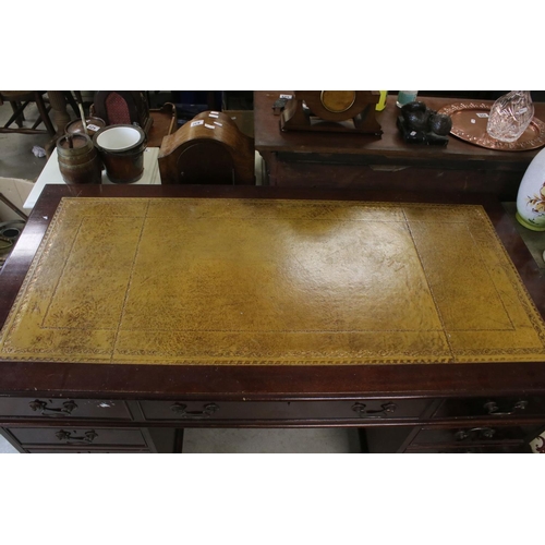 680 - George III style Mahogany twin pedestal desk with brown inset leather top and an arrangement of nine... 