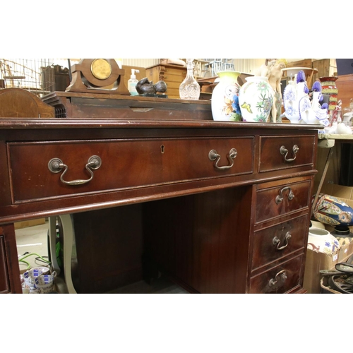 680 - George III style Mahogany twin pedestal desk with brown inset leather top and an arrangement of nine... 