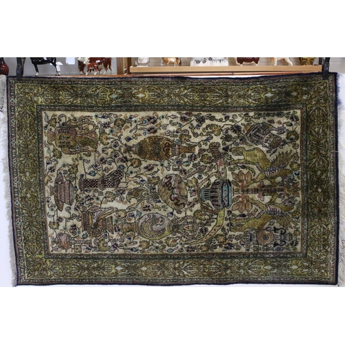 686 - Persian silk rug, second half 20th century, with Safavid style designs of winged animals, precious v... 