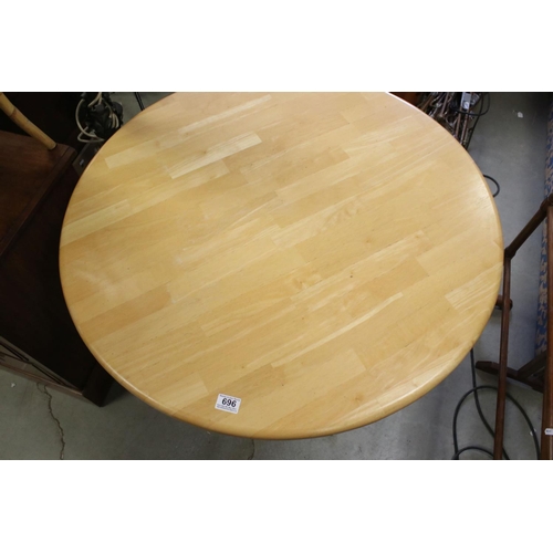 696 - Circular Beechwood Table raised on a Painted Metal Base, 90cms diameter x 76cms high