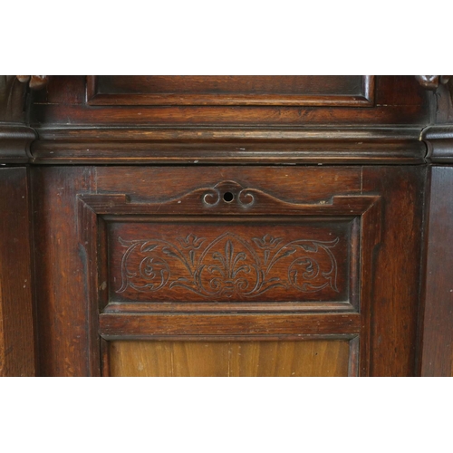 699 - Early 20th century Oak Cabinet, with lift lid and hinged fall front, carved Corinthian column suppor... 