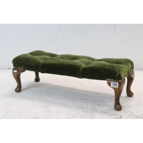 700 - Early 20th century Footstool with green button upholstered top and cabriole legs, 66cms long x 23cms... 