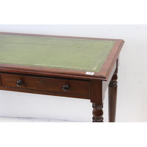 706 - Victorian mahogany writing table with two drawers, turned legs and castors, approx 117cm wide