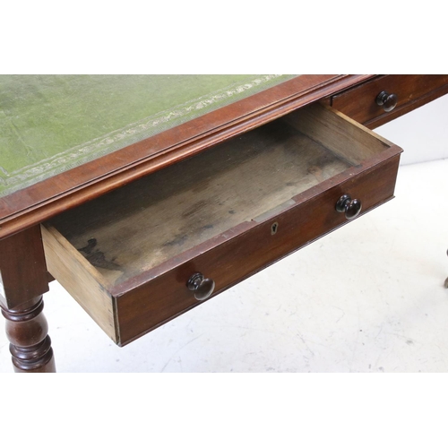 706 - Victorian mahogany writing table with two drawers, turned legs and castors, approx 117cm wide