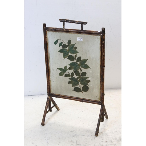 707 - 19th century Bamboo Framed Fire Screen, the ribbed glass panel decorated with flowers, 46cms wide  x... 