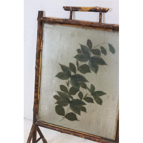 707 - 19th century Bamboo Framed Fire Screen, the ribbed glass panel decorated with flowers, 46cms wide  x... 