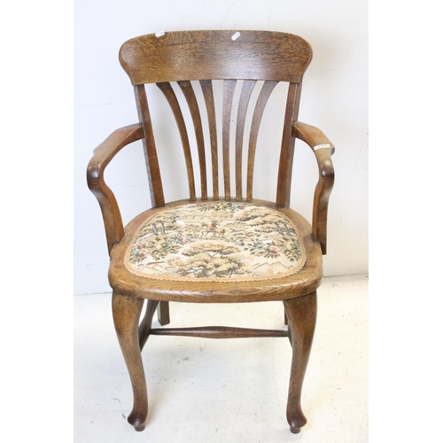 715 - Early 20th century Oak Elbow Chair together with a small Upholstered Footstool