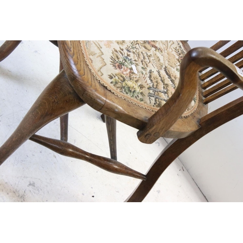 715 - Early 20th century Oak Elbow Chair together with a small Upholstered Footstool