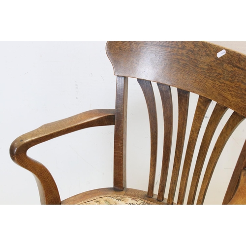 715 - Early 20th century Oak Elbow Chair together with a small Upholstered Footstool